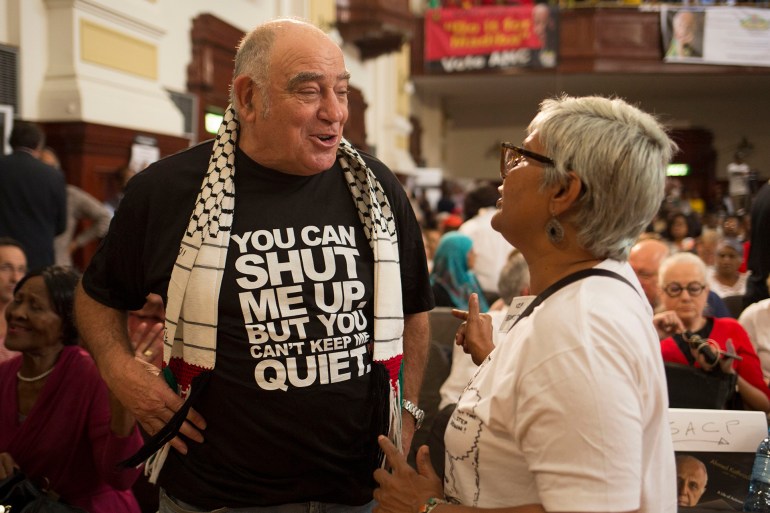 epa05883060 Former anti-apartheid struggle veteran Ronnie Kasrils (L) with supporters of late anti-apartheid activist Ahmed Kathrada, attended his public memorial service in Johannesburg, South Africa, 01 April 2017. Kathrada, an anti-apartheid struggle icon and close friend of the late former South African President, Nelson Mandela died on 28 March. The memorial was supposed to be hosted by the President Zuma led government but was cancelled by them suddenly, leaving the Nelson Mandela Foundation, the South African Communist Party and the Ahmed Kathrada Foundation to host the event. EPA/CORNELL TUKIRI