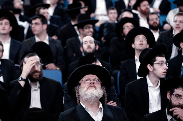 Thousands of ultra-Orthodox Ashkenazi Jews gather in a sports arena in Jerusalem on March 15, 2015, in a show of force less than two days before general elections. Israel goes to the polls on March 17, 2015 for the second general election in as many years with pundits unanimous that it is turning out to be a referendum on Prime Minister Benjamin Netanyahu's six years as premier. AFP PHOTO / THOMAS COEX (Photo by THOMAS COEX / AFP)