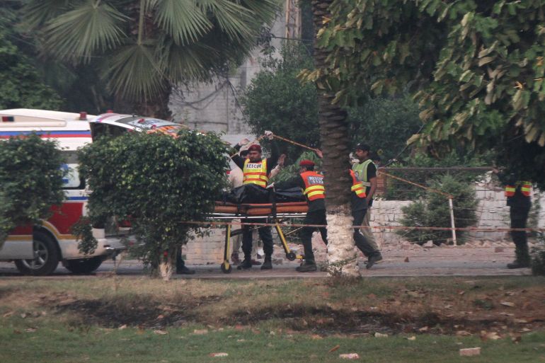 Rescuers wheel a body towards an ambulance after it was recovered from a building hit by an Indian strike in Muridke near Lahore, Pakistan, May 7, 2025. REUTERS/Mohsin Raza