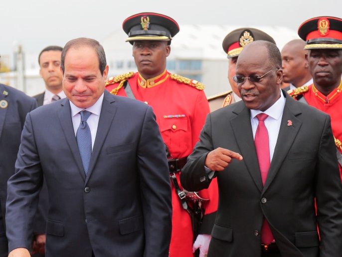 Egyptian President Abdel Fattah al-Sisi (L) walks alongside of Tanzania's President John Magufuli upon arriving at the Julius Nyerere International Airport in Dar es Salaam, Tanzania August 14, 2017. REUTERS/Emmanuel Herman