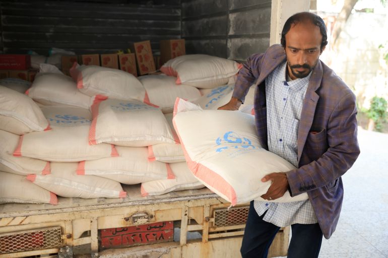 epa12275282 A worker unloads food aid from a truck, supplied by Mona Relief agency, for distribution to families facing food insecurity, in Sana'a, Yemen, 31 July 2025. Yemen’s food security situation is projected to worsen between September 2025 and February 2026 with an estimated 18.1 million people, 52 percent of the war-ravaged Arab country’s population, expected to face high levels of acute food insecurity due to severe economic decline, conflict and severe reductions in humanitarian aid, according to a recent report by the Integrated Food Security Phase Classification (IPC). EPA/YAHYA ARHAB